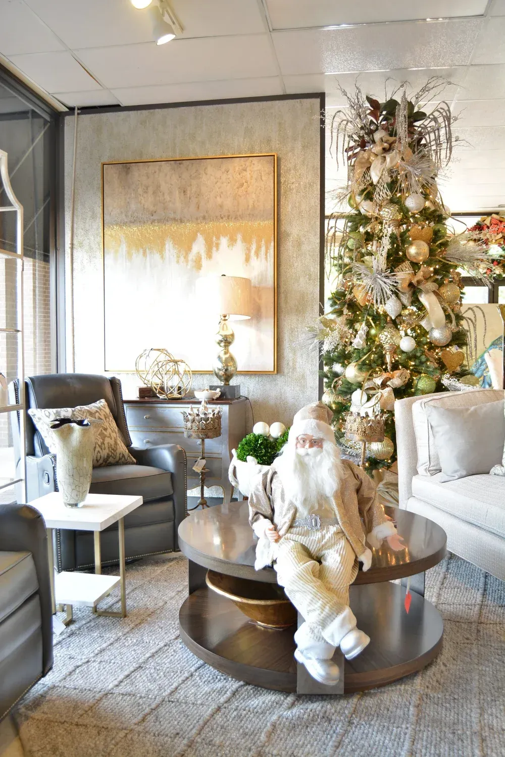 Festive living room with decorated Christmas tree and Santa figure on a coffee table