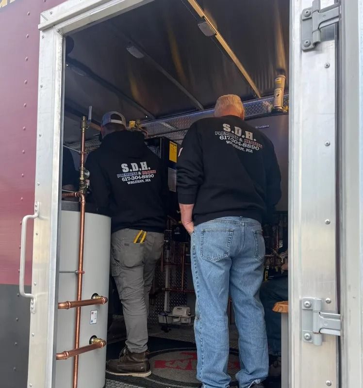 Two people wearing black sweatshirts with 