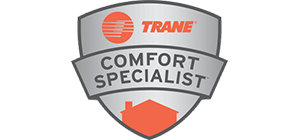 Trane Comfort Specialist badge, silver shield with orange Trane logo, house icon.