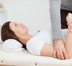 Woman getting treated by chiropractor