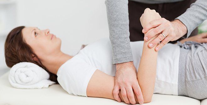 Woman getting treated by chiropractor