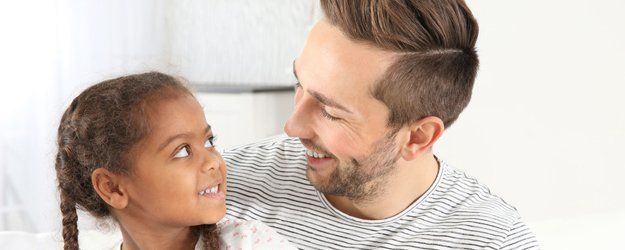 Smiling man and child