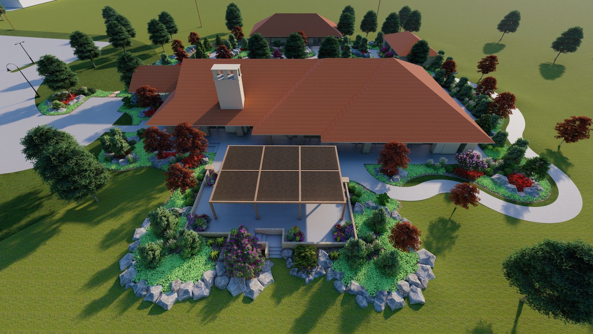 Overhead view of a home with a terracotta roof, patio, and surrounding landscaping with trees and shrubs.