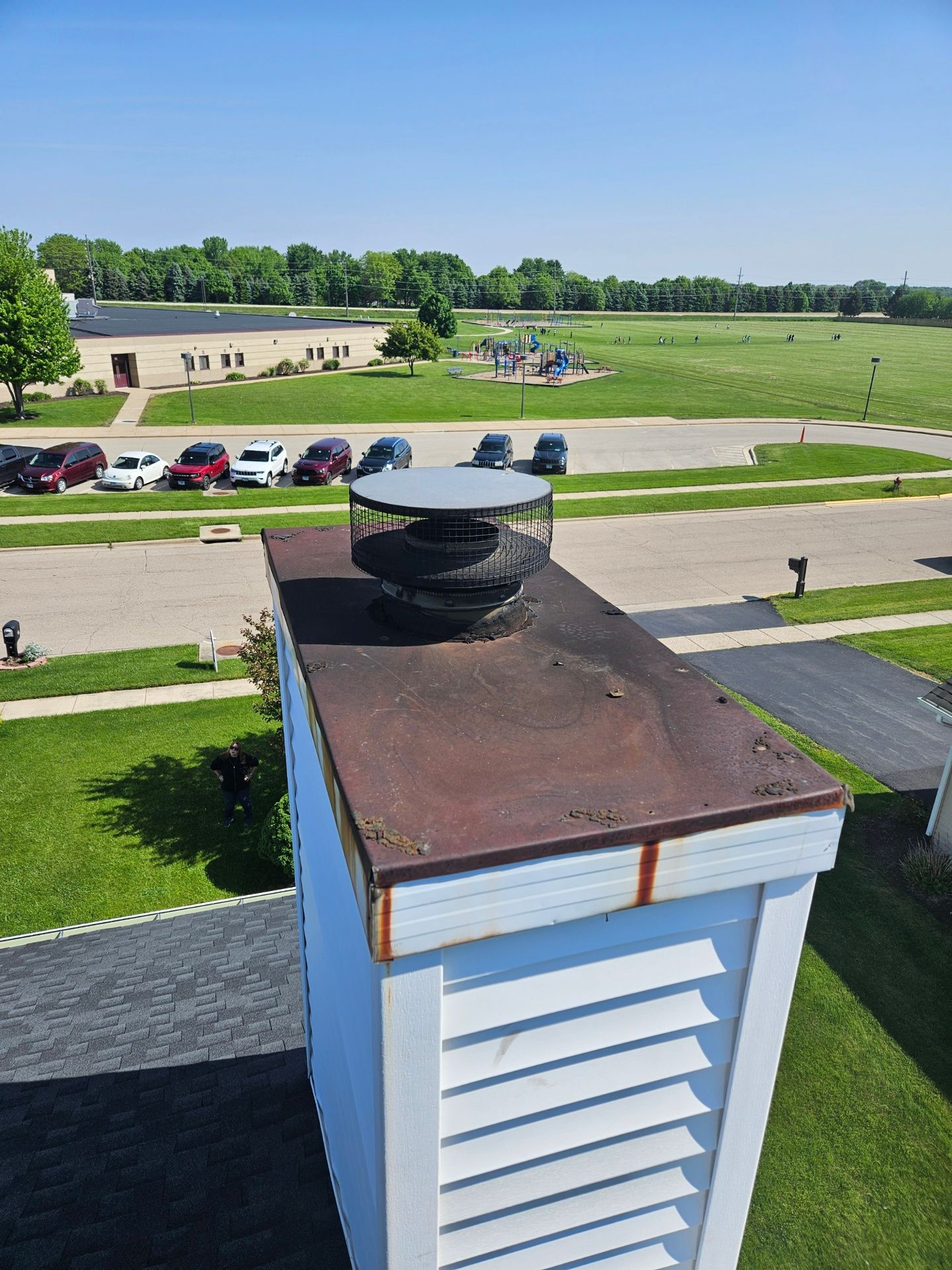 An aerial view of a chimney on top of a building.