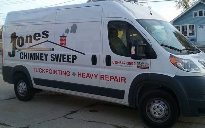 A white van that says Jones Chimney Sweep on the side.