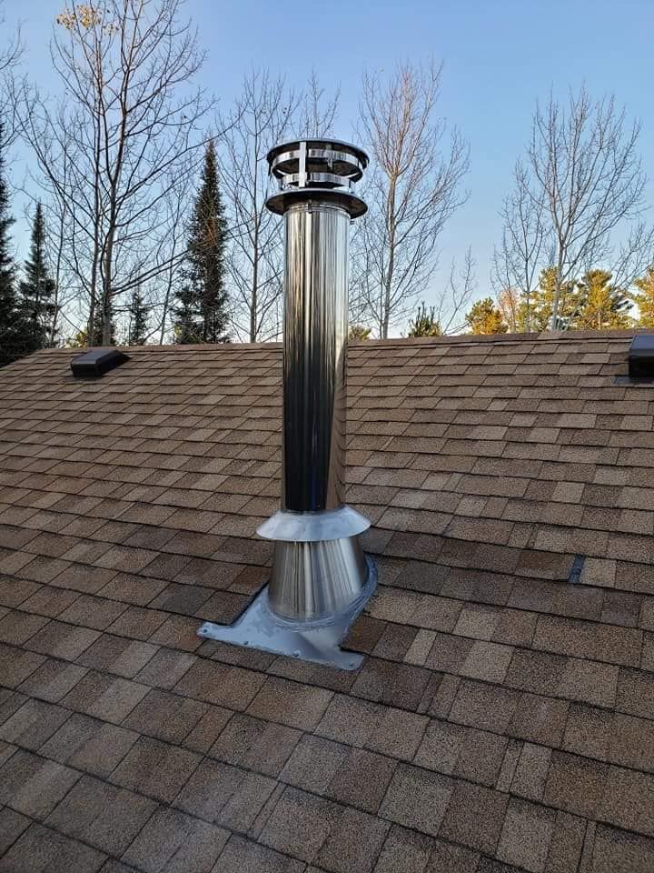 There is a chimney on the roof of a house.