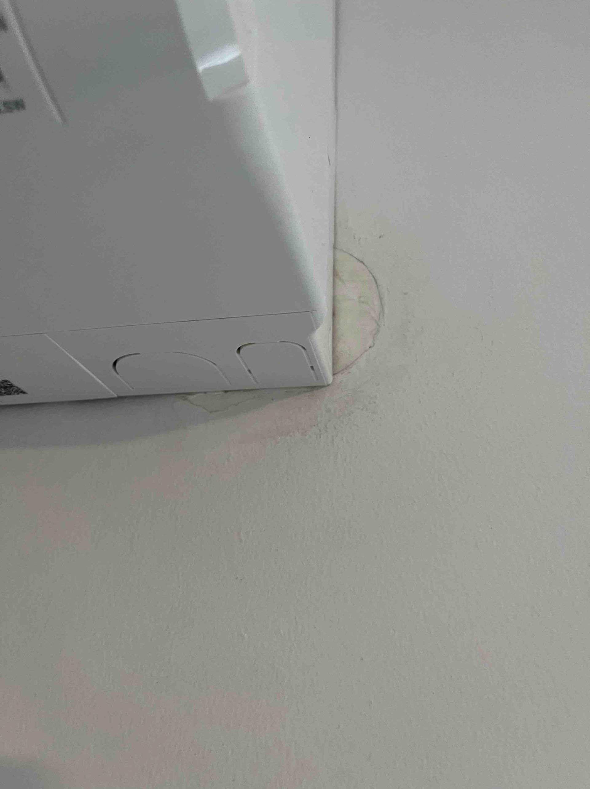 White wall with an electrical box, circle outline marks a previous installation.