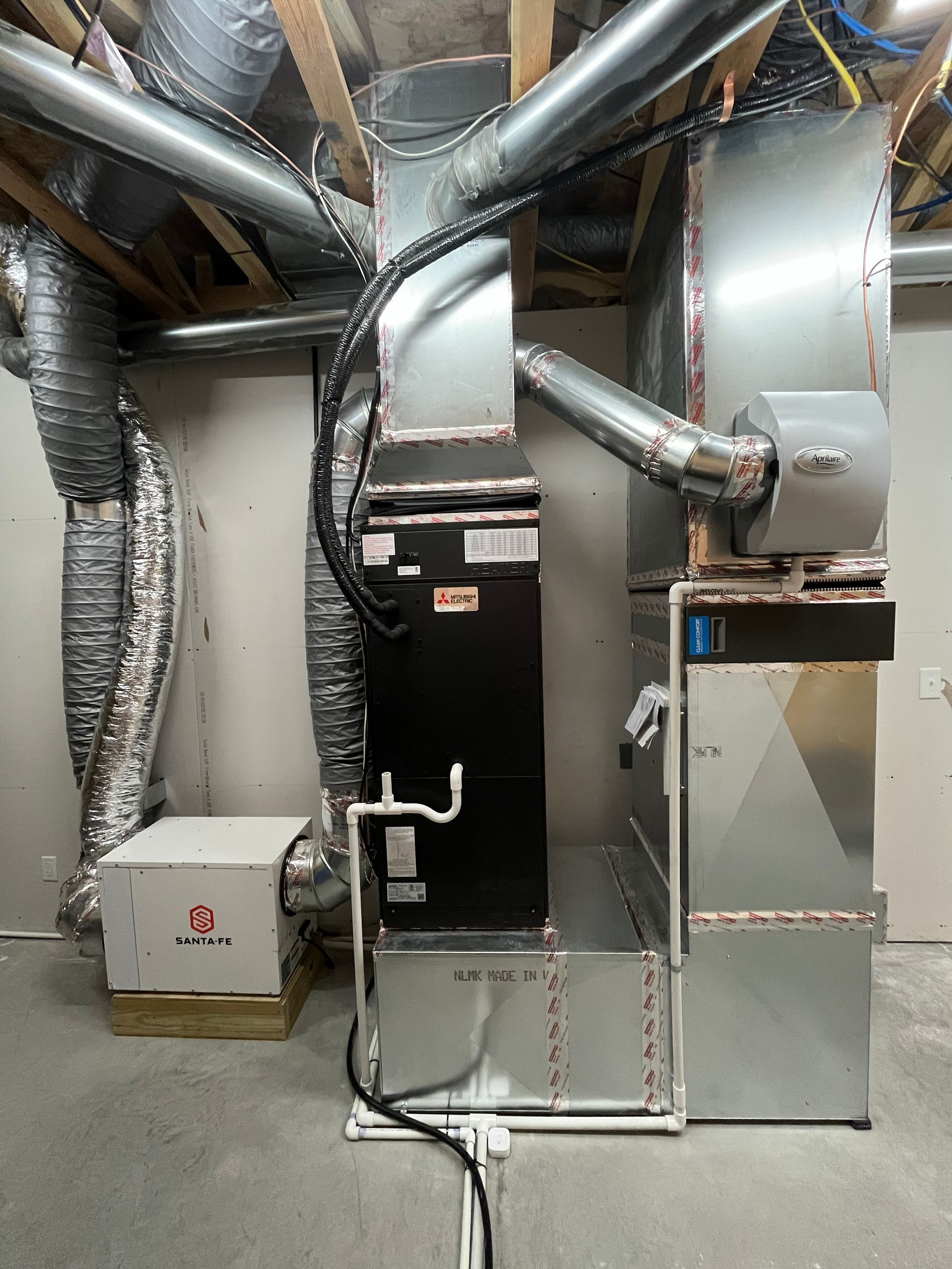 HVAC system with metal ductwork in a basement setting.
