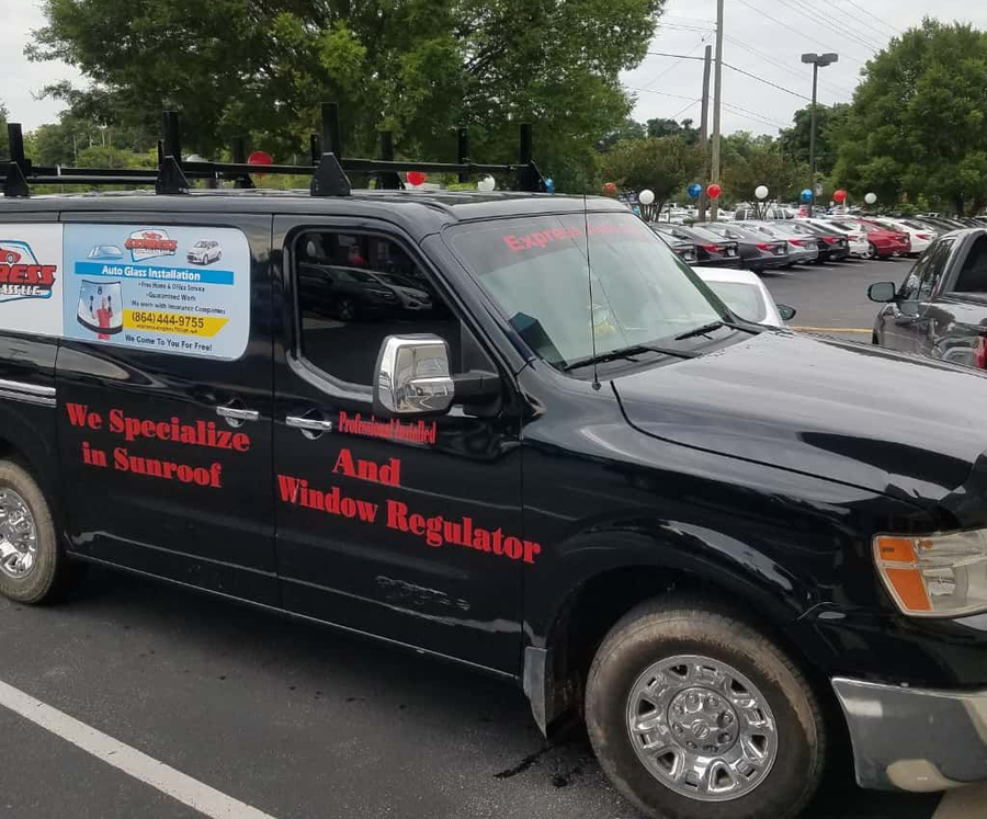 Black van with a sticker that says We Specialize in Sunroof and Window Regulator