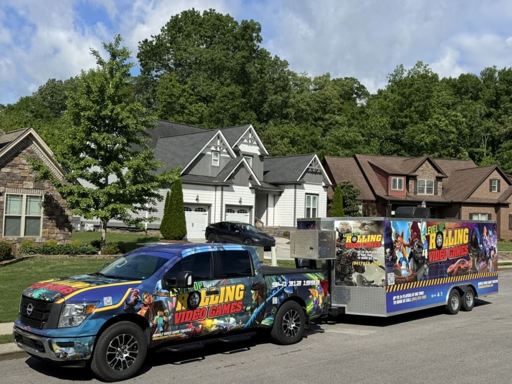 A pickup truck with a trailer advertising 