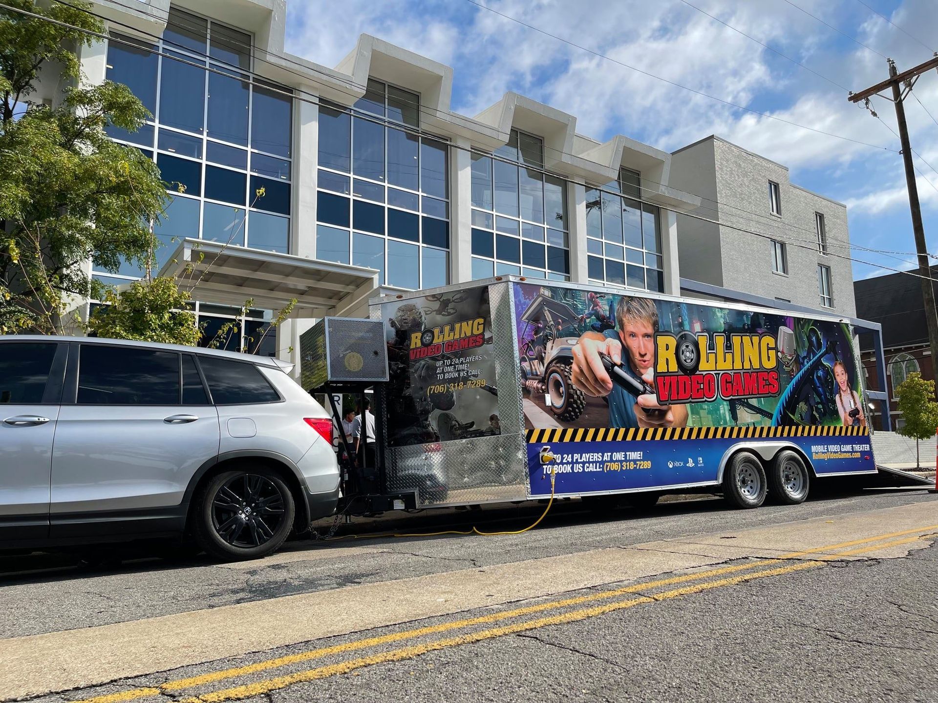 A silver SUV connected to a trailer with 