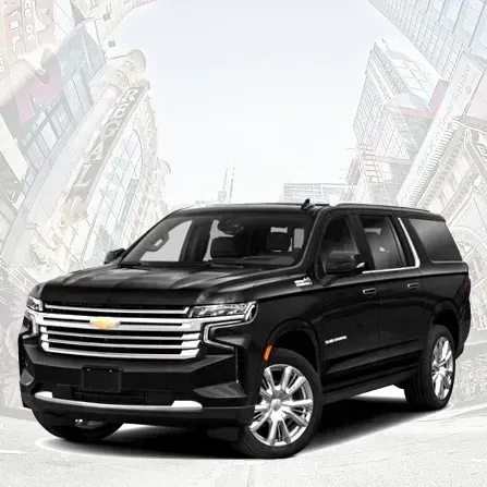 Black Chevrolet SUV on a city street with buildings in the background