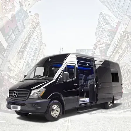Black Mercedes Sprinter passenger van with open side door, shown in a bright urban street scene