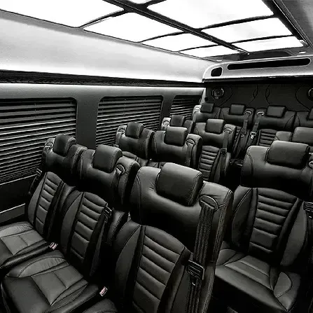 Empty black leather lounge seats inside a modern luxury vehicle or train cabin