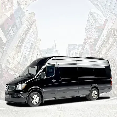 Black passenger van on a city street with tall buildings in the background