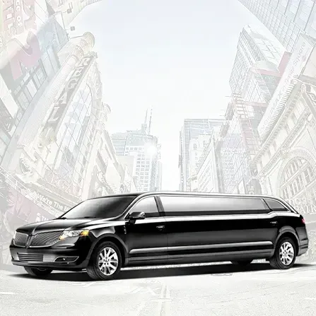 Black stretch limousine on a city street with tall buildings in the background