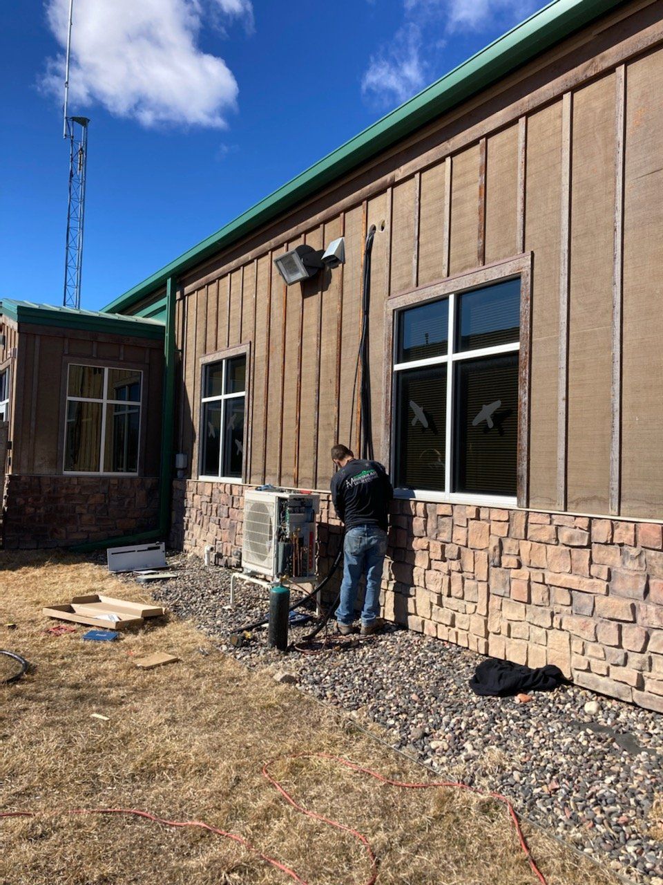 Man working on an HVAC unit