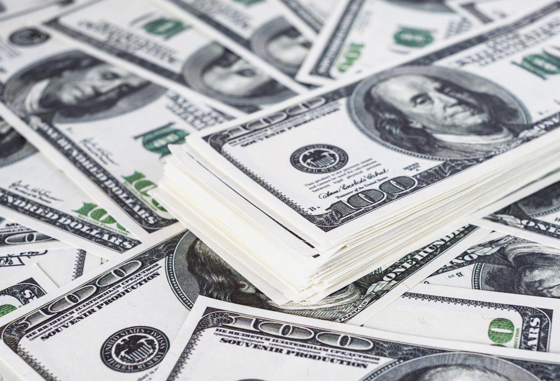 Happy couple with cash on hand