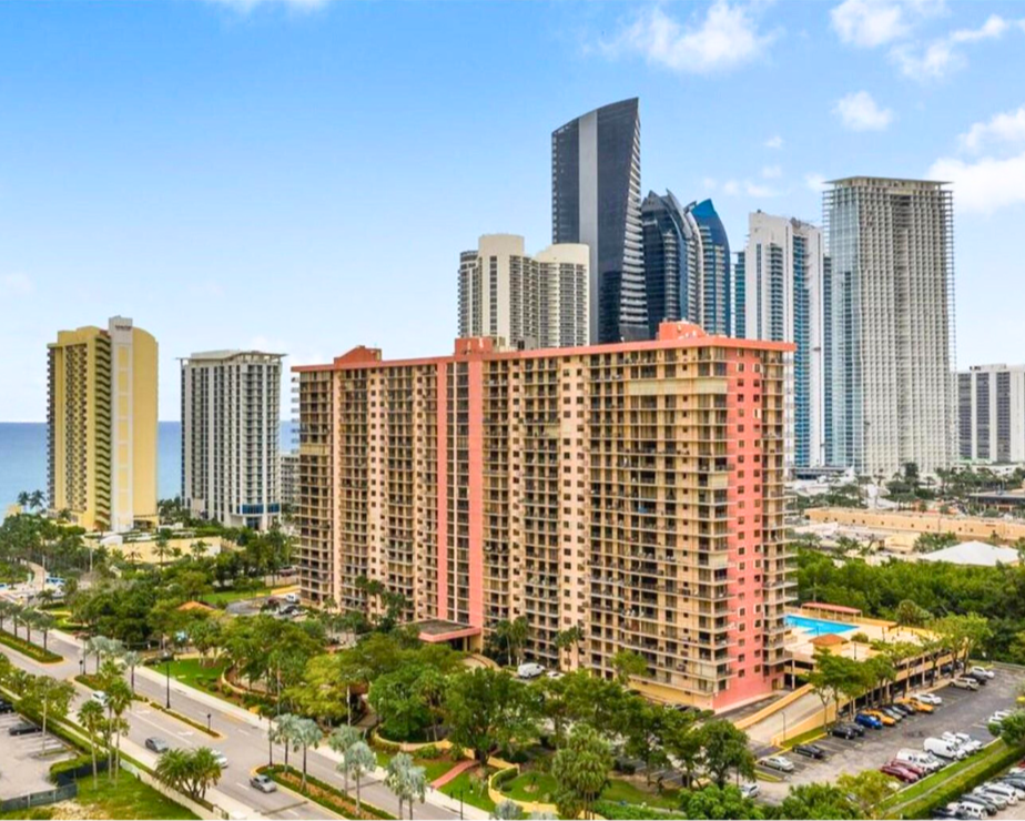 An aerial view of a city with a lot of tall buildings