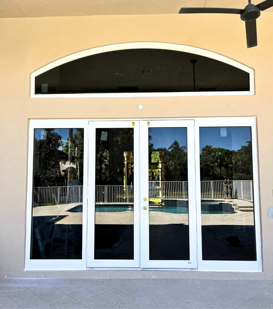 A French Door with Sidelights  leading to a swimming pool