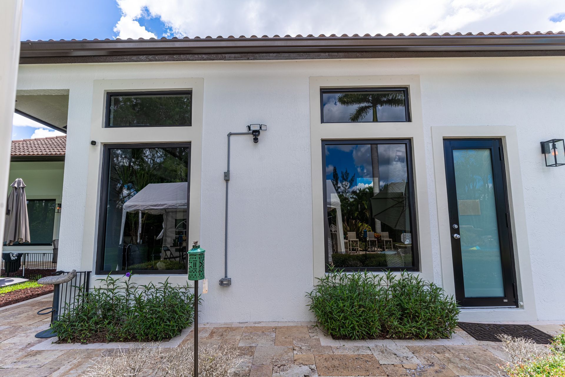 A white house with a black door and windows