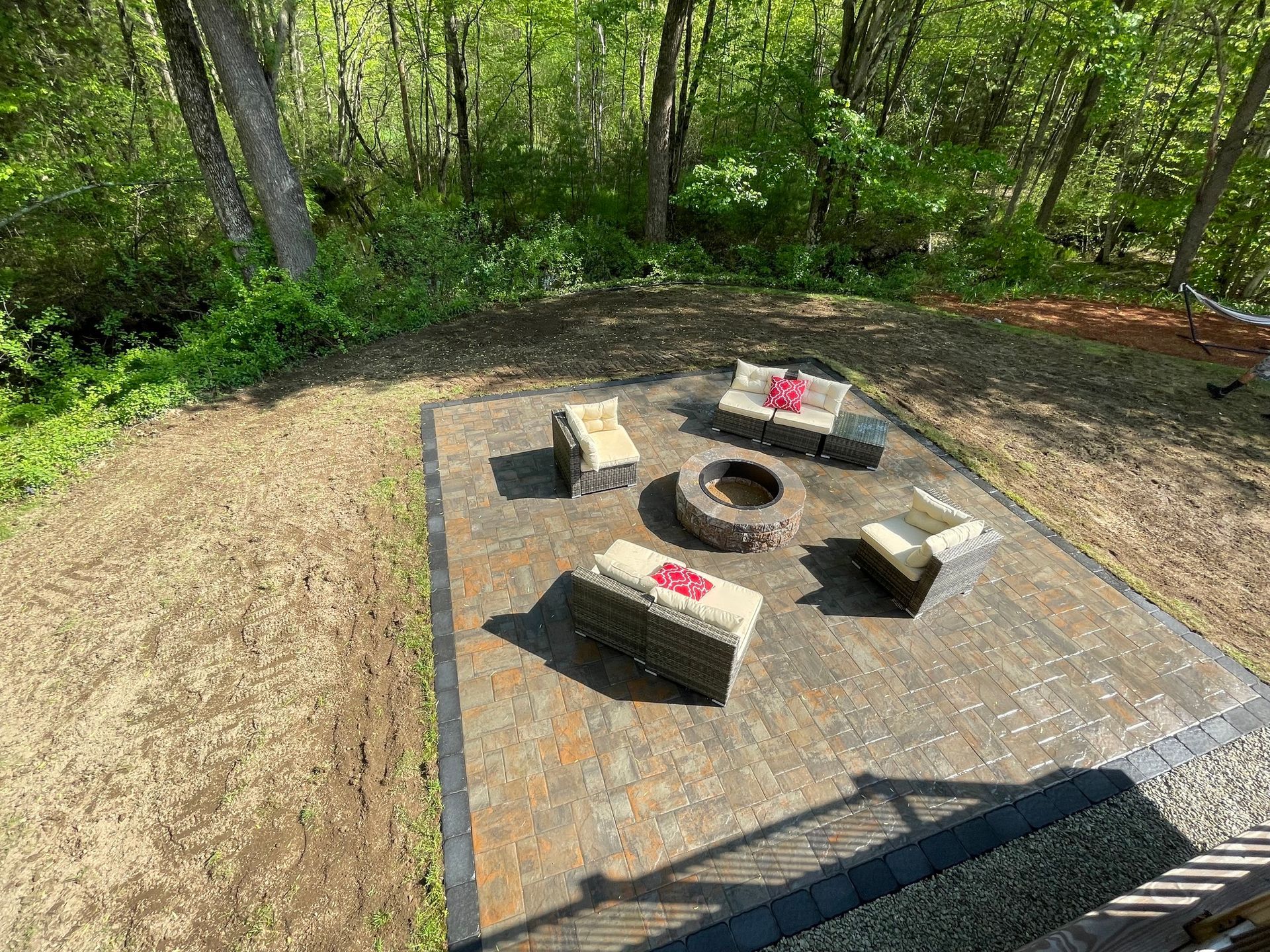 There is a fire pit in the middle of the patio.