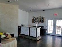 Interior with bar, hats, exit doors, and 