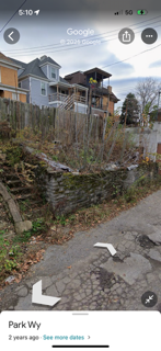 A picture of a house on google maps on a phone.