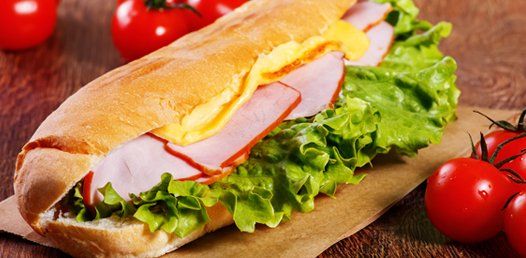 Sub with sliced ham and lettuce
