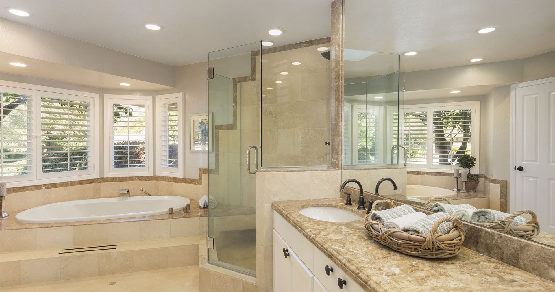 a house with a large deck and stairs surrounded by trees