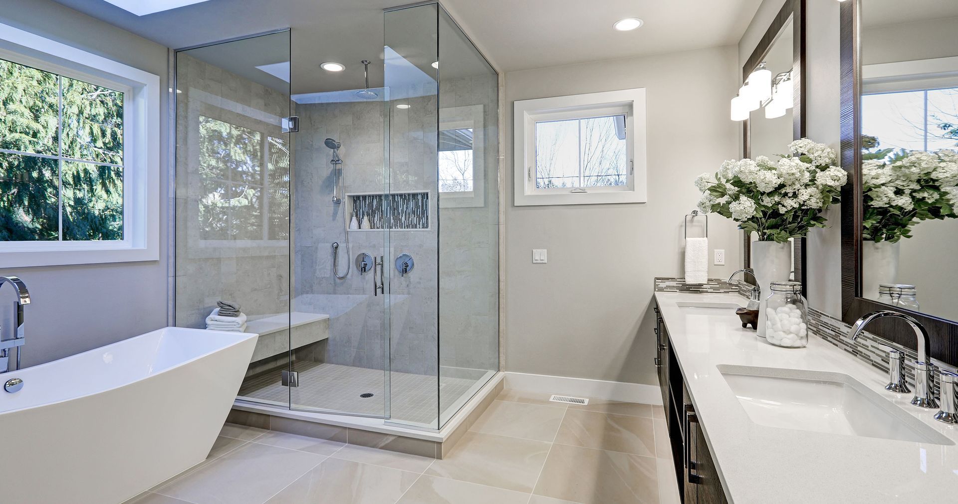 a bathroom with a tub , sink , and shower .