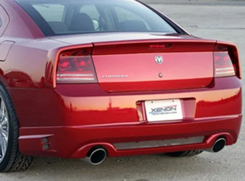 Rear view of a red Dodge Charger parked outdoors with a Xenon license plate frame