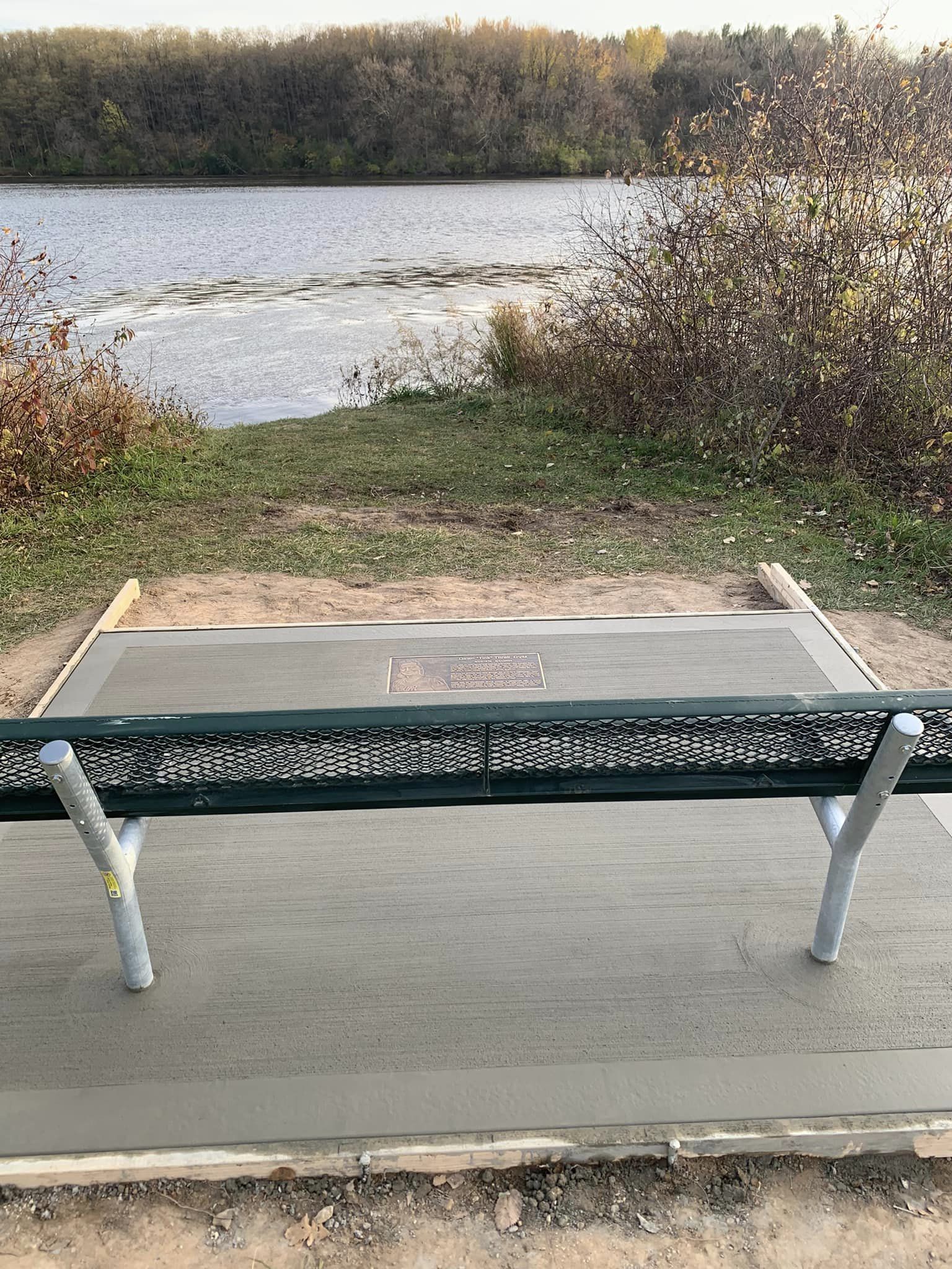 Concrete flooring with metal bench