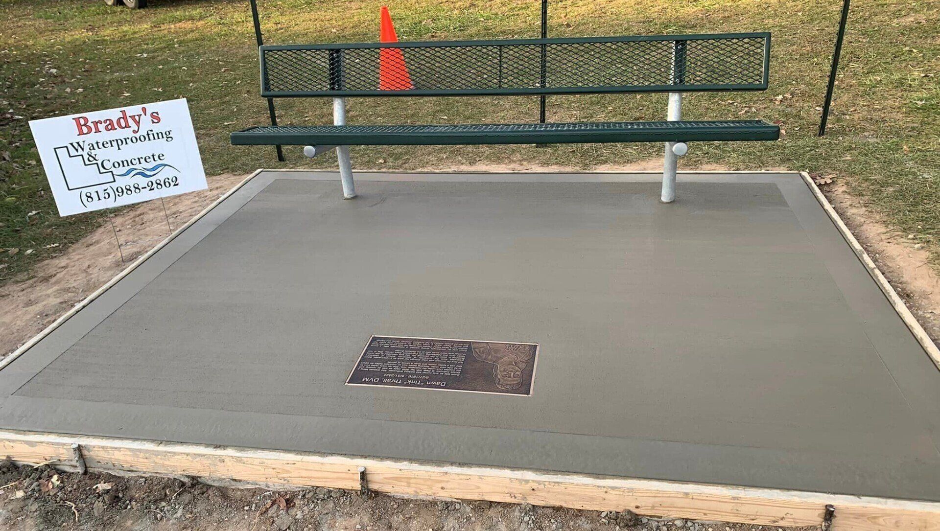 Concrete flooring with metal bench