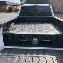 Truck bed with black storage drawers.