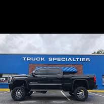 Black pickup truck in front of