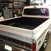 White truck bed of a classic Chevrolet pickup.