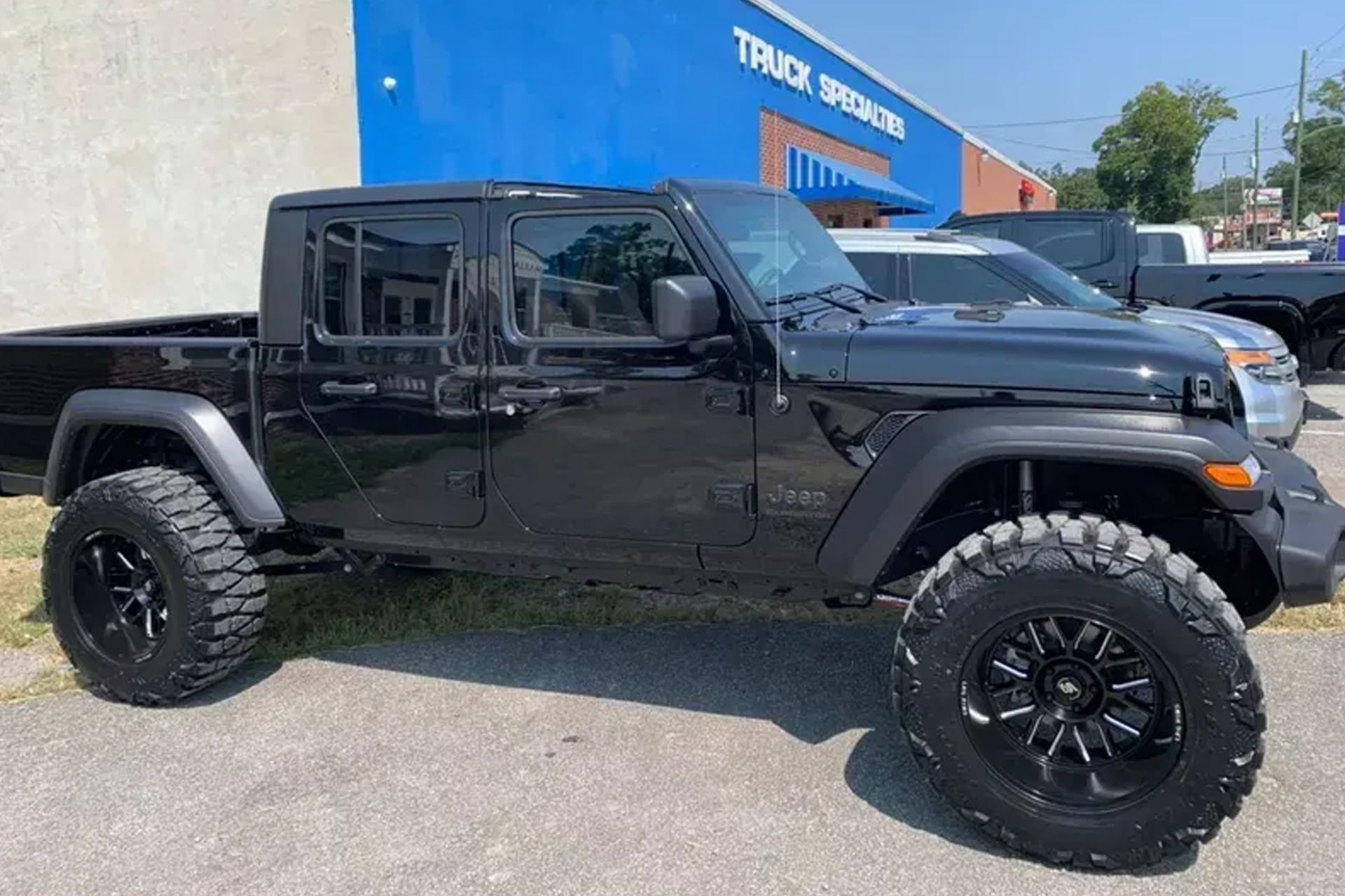 White delivery vans parked in a line.