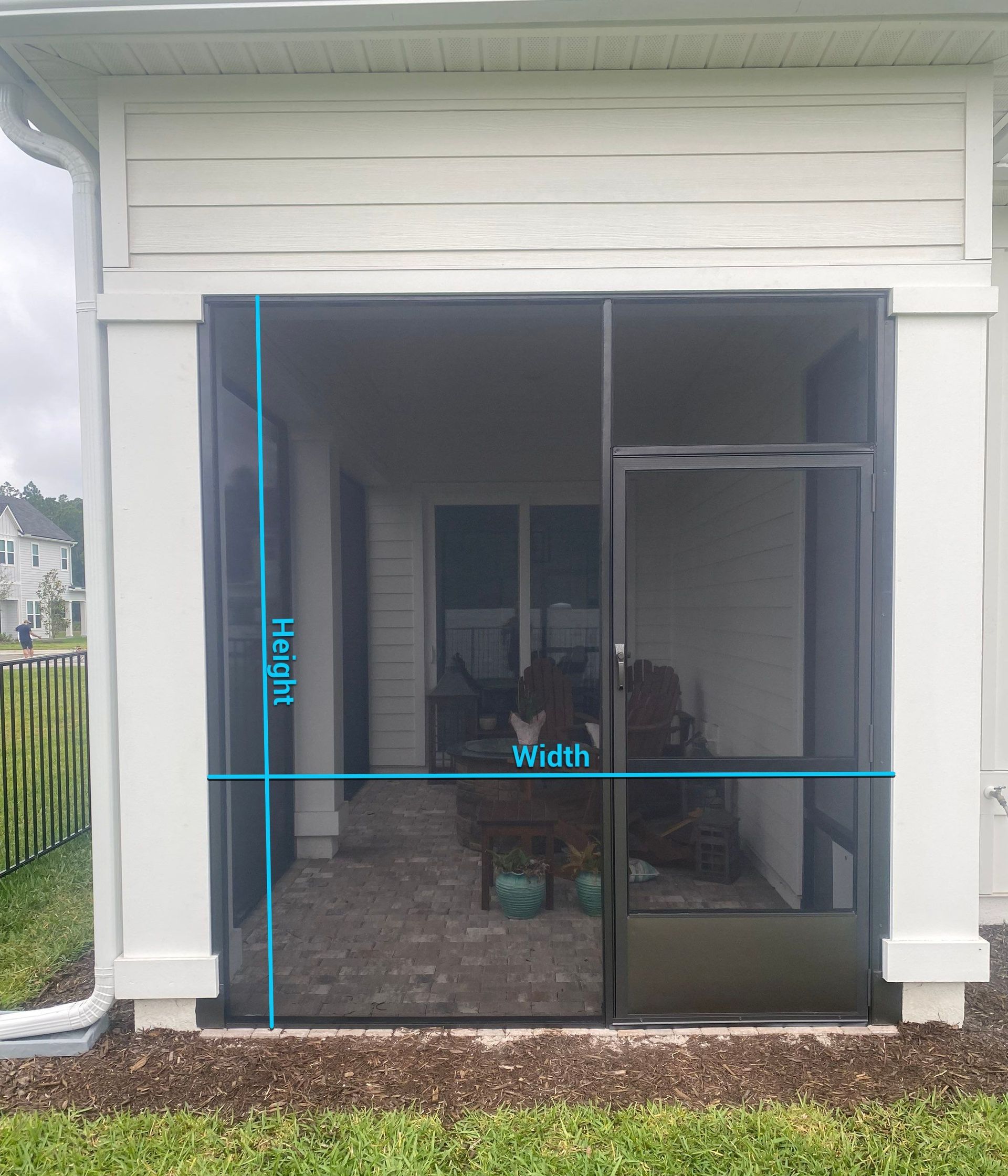 Sliding glass door on a screened patio with blue measurement lines marking height and width.