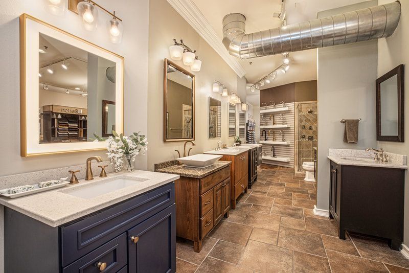 Bathroom showroom with various vanities, mirrors, and lighting fixtures.