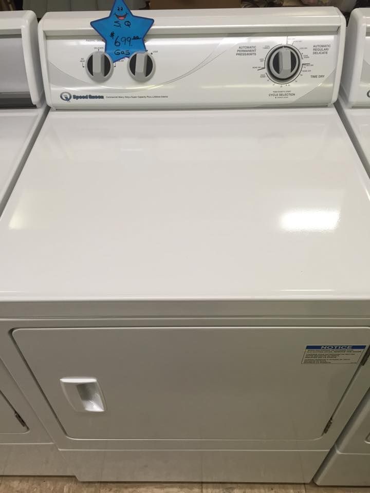 A white washer and dryer with a blue star on top of it.