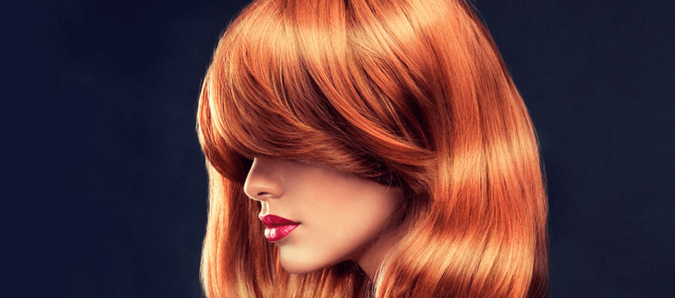 Girl with beautiful and shiny red hair