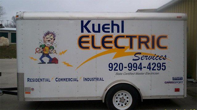 A white trailer that says kuchl electric services on it