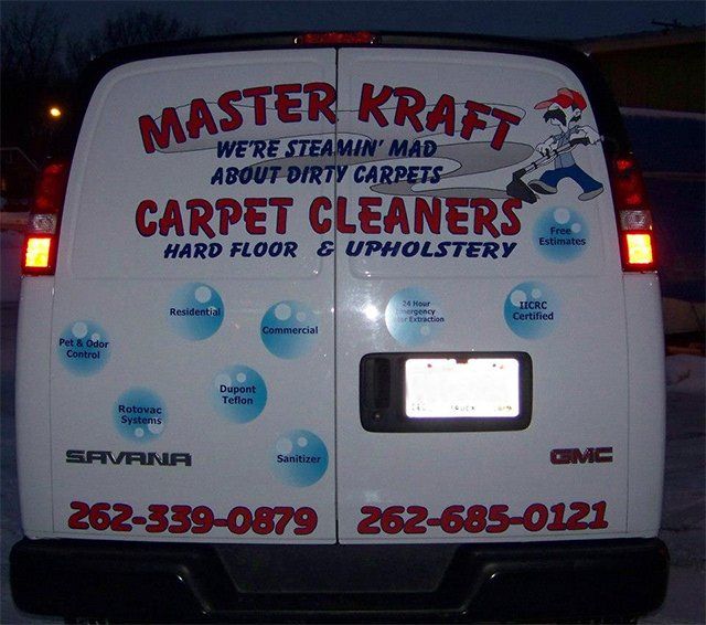 The back of a master kraft carpet cleaners van
