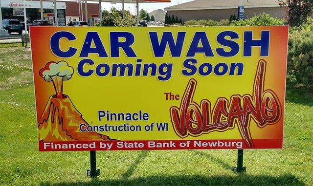 A sign that says car wash coming soon on it