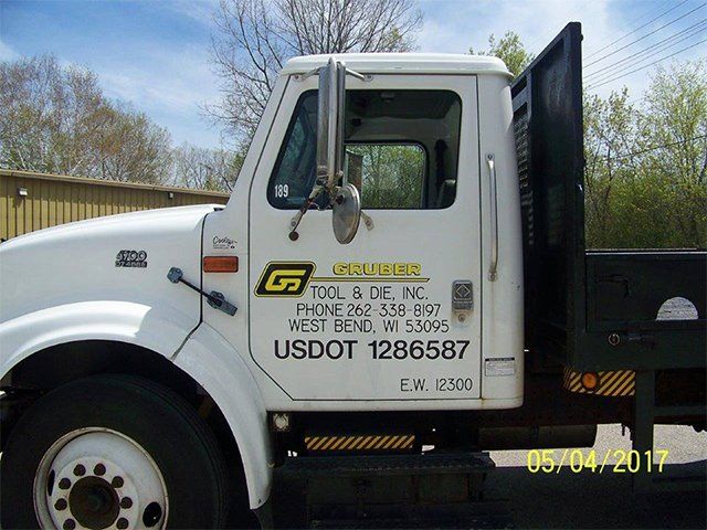 A white truck with usdot 1286587 written on the side