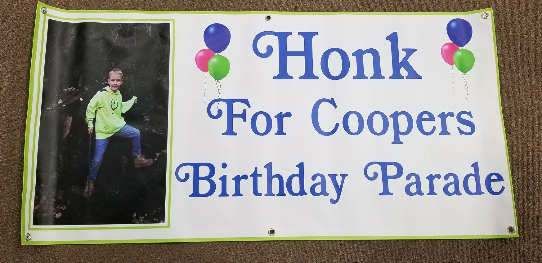 A banner for Cooper's Birthday Parade with a photo and text, Honk For Cooper's Birthday Parade Balloons.