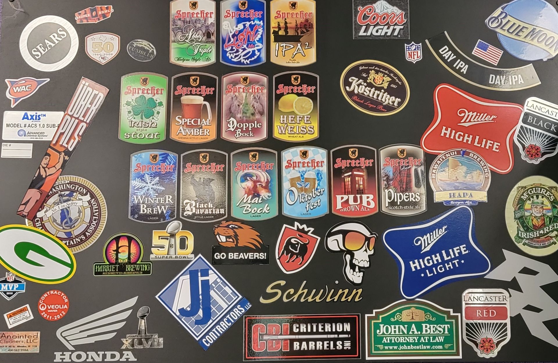 A bunch of stickers on a table including schwinn