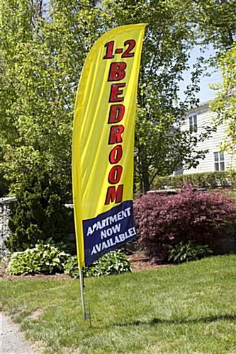 A yellow flag that says `` 1-2 bedroom apartment now available '' is sitting in the grass in front of a house.
