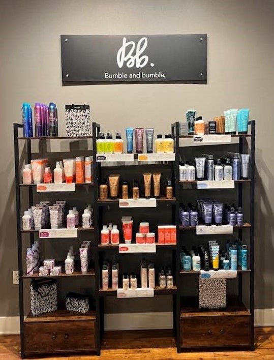 A display of hair products in a store with a sign that says bb.